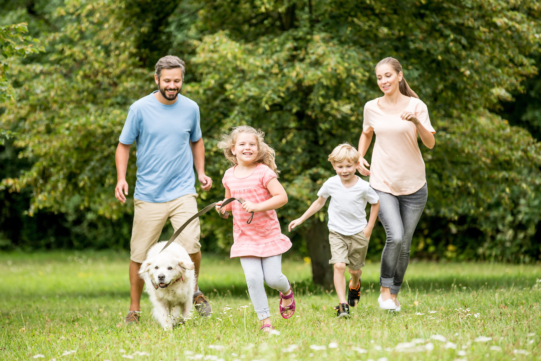Family Running with Dog